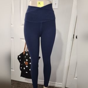New Beyond Yoga leggings M size with unique waist design.